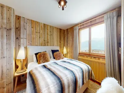 Ein Bett oder Betten in einem Zimmer der Unterkunft Beautiful chalet in Le Bouveret with garden