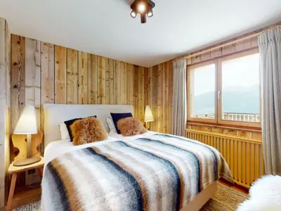 Ein Bett oder Betten in einem Zimmer der Unterkunft Beautiful chalet in Le Bouveret with garden