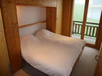 Ein Bett oder Betten in einem Zimmer der Unterkunft Traditional apartment with balcony