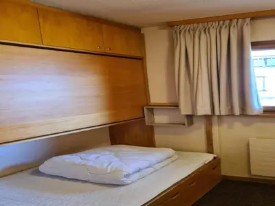 Ein Bett oder Betten in einem Zimmer der Unterkunft Apartment Veysonnaz near Ski Lift & Shuttle