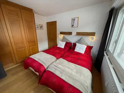 Ein Bett oder Betten in einem Zimmer der Unterkunft Cosy Rooftop Downtown Crans-Montana with Stunning View and Swimming Pool