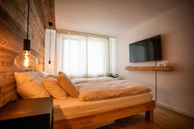 Ein Bett oder Betten in einem Zimmer der Unterkunft LUMA appartment Zermatt
