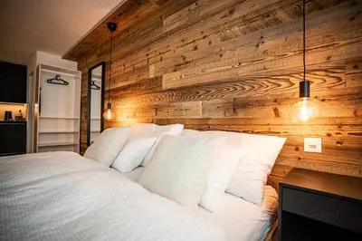 Ein Bett oder Betten in einem Zimmer der Unterkunft LUMA appartment Zermatt