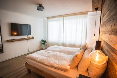 Ein Bett oder Betten in einem Zimmer der Unterkunft MALU appartment Zermatt
