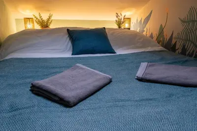 Ein Bett oder Betten in einem Zimmer der Unterkunft Tiny house Les Nomades