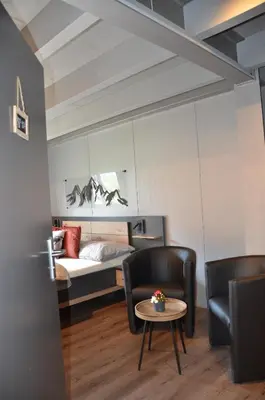 Ein Bett oder Betten in einem Zimmer der Unterkunft Q-Lodge 104