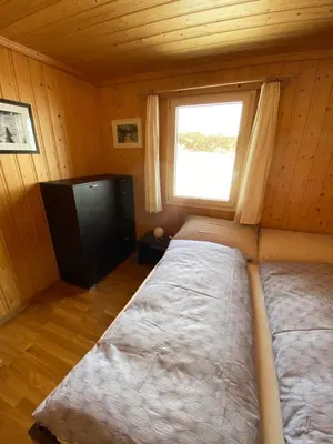 Ein Bett oder Betten in einem Zimmer der Unterkunft Panoramalodge Aatos