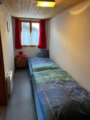 Ein Bett oder Betten in einem Zimmer der Unterkunft Alpenrose Aletsch Landschaftspark Binntal