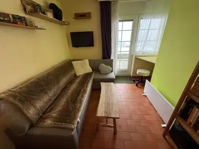 Ein Sitzbereich in der Unterkunft Studio accessible en ski et en voiture