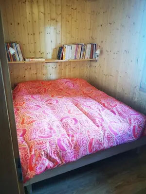 Ein Bett oder Betten in einem Zimmer der Unterkunft Chalet St-Hubert