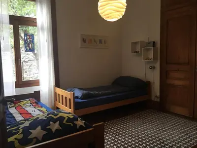 Ein Bett oder Betten in einem Zimmer der Unterkunft Wild Valley Ticino Villa in Valle Onsernone