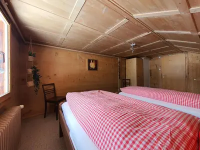 Ein Bett oder Betten in einem Zimmer der Unterkunft Burgbühler Guesthouse