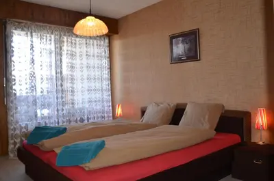 Ein Bett oder Betten in einem Zimmer der Unterkunft Immeuble Mont Noble