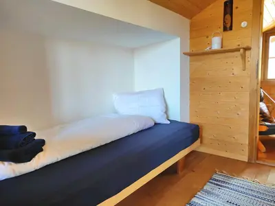 Ein Bett oder Betten in einem Zimmer der Unterkunft Schärmtanne entire chalet 15 min to Interlaken
