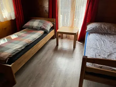 Ein Bett oder Betten in einem Zimmer der Unterkunft Alpen Rose 3 Wohnungen