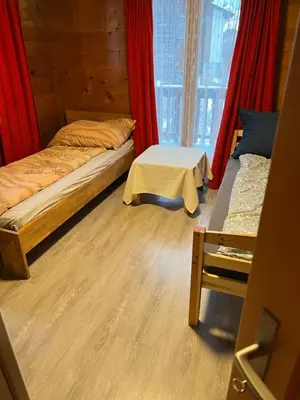 Ein Bett oder Betten in einem Zimmer der Unterkunft Alpen Rose 3 Wohnungen