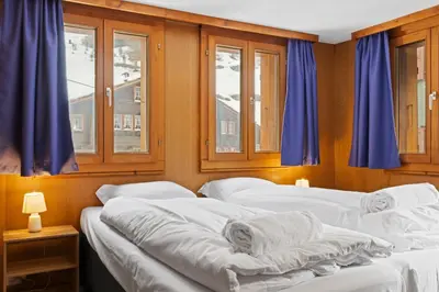 Ein Bett oder Betten in einem Zimmer der Unterkunft Charmant appartement familiale proche de Saas-Fee