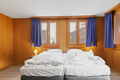 Ein Bett oder Betten in einem Zimmer der Unterkunft Charmant appartement familiale proche de Saas-Fee