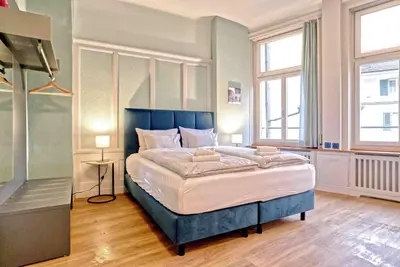Ein Bett oder Betten in einem Zimmer der Unterkunft BANK House Studio M 106 - GRIWA RENT
