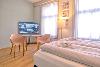 Ein Bett oder Betten in einem Zimmer der Unterkunft BANK House Studio M 203 - GRIWA RENT
