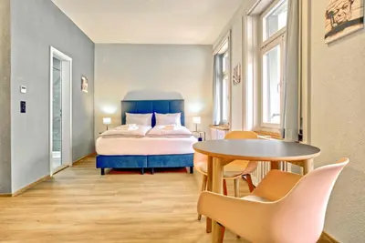 Ein Bett oder Betten in einem Zimmer der Unterkunft BANK House Studio M 302 - GRIWA RENT