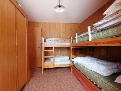 Ein Bett oder Betten in einem Zimmer der Unterkunft Edelweiss Anzère