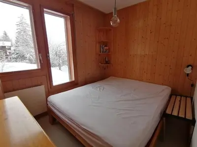 Ein Bett oder Betten in einem Zimmer der Unterkunft Edelweiss Anzère