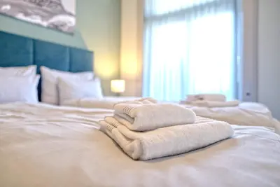 Ein Bett oder Betten in einem Zimmer der Unterkunft BANK House Suite 303 - GRIWA RENT