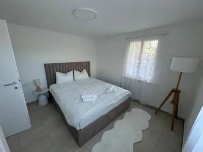 Ein Bett oder Betten in einem Zimmer der Unterkunft Appartement Niesenblick 1