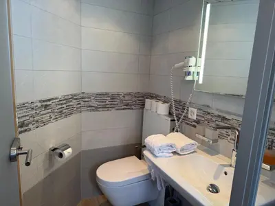 Ein Badezimmer in der Unterkunft Ferienwohnungen Eden und Simonella