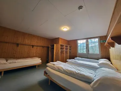Ein Bett oder Betten in einem Zimmer der Unterkunft Nordic Arena House