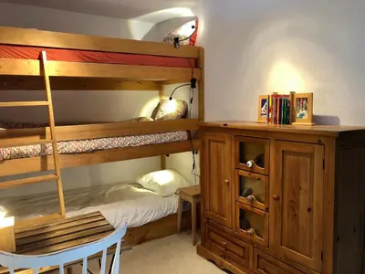Ein Bett oder Betten in einem Zimmer der Unterkunft Immeuble Les Aiglons