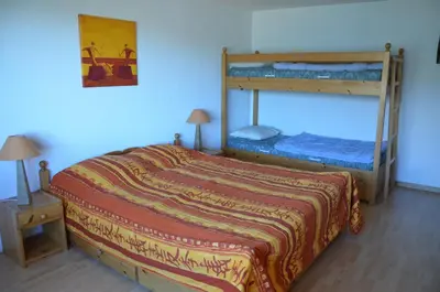 Ein Bett oder Betten in einem Zimmer der Unterkunft Immeuble Les Aiglons