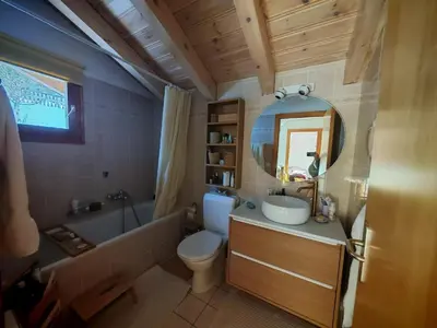 Ein Badezimmer in der Unterkunft Chalet cosy avec vue incroyable