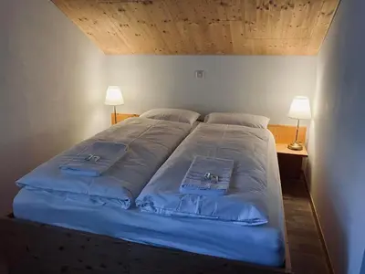 Ein Bett oder Betten in einem Zimmer der Unterkunft Sust Lodge