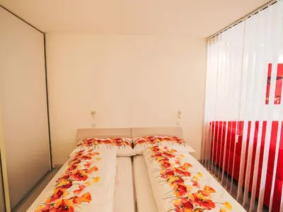 Ein Bett oder Betten in einem Zimmer der Unterkunft Apartment Cristal-8 by Interhome