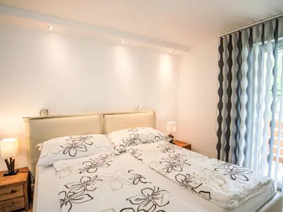 Ein Bett oder Betten in einem Zimmer der Unterkunft Apartment Cristal-11 by Interhome