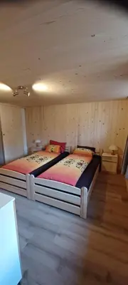 Ein Bett oder Betten in einem Zimmer der Unterkunft Dorfblick