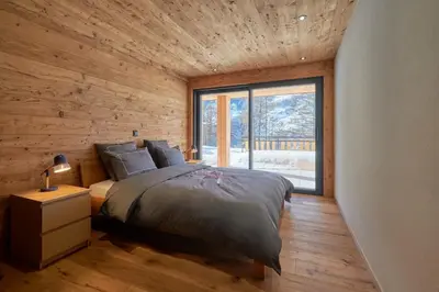 Ein Bett oder Betten in einem Zimmer der Unterkunft New high standing chalet