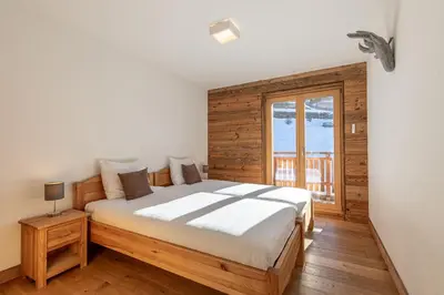 Ein Bett oder Betten in einem Zimmer der Unterkunft Les Mayens MB 021 - LUXURY apartment 18 pers
