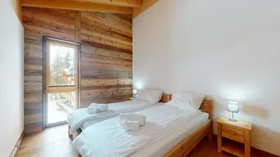 Ein Bett oder Betten in einem Zimmer der Unterkunft Les Mayens MA 021 - LUXURY apartment 18 pers