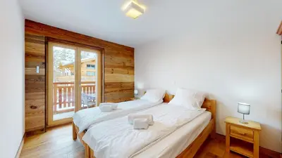 Ein Bett oder Betten in einem Zimmer der Unterkunft Les Mayens MA 021 - LUXURY apartment 18 pers