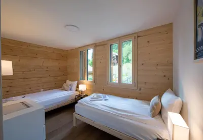 Ein Bett oder Betten in einem Zimmer der Unterkunft Chalet Rubi
