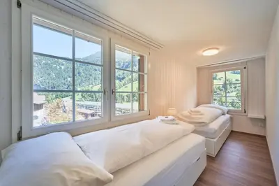 Ein Bett oder Betten in einem Zimmer der Unterkunft Lauterbrunnen Central 1