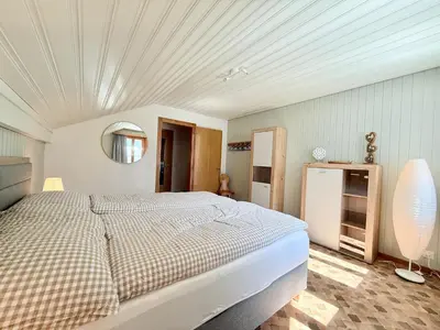 Ein Bett oder Betten in einem Zimmer der Unterkunft Fewo 'Alpegärtli' BeO Apartments