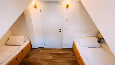 Ein Bett oder Betten in einem Zimmer der Unterkunft The Timber Apartment in Brienz