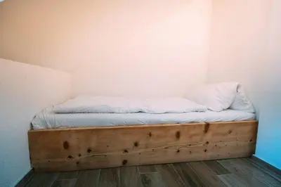 Ein Bett oder Betten in einem Zimmer der Unterkunft The Timber Apartment in Brienz