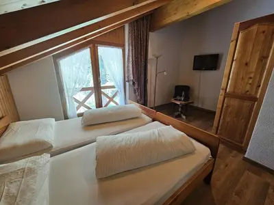 Ein Bett oder Betten in einem Zimmer der Unterkunft Lärchen Lodge