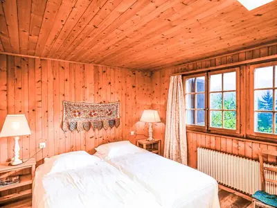 Ein Bett oder Betten in einem Zimmer der Unterkunft Chalet La Capsule by Interhome