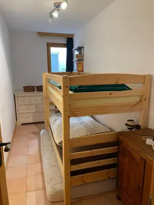 Ein Bett oder Betten in einem Zimmer der Unterkunft Charme assuré